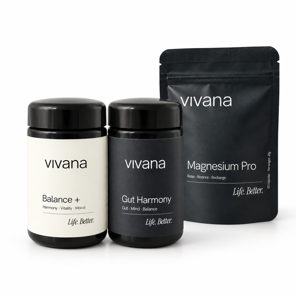 Two navy supplement jars and one black stand-up pouch from vivana on a clean white background. The left jar is Balance+ and the center jar is Gut Harmony; the pouch behind is Magnesium Pro.